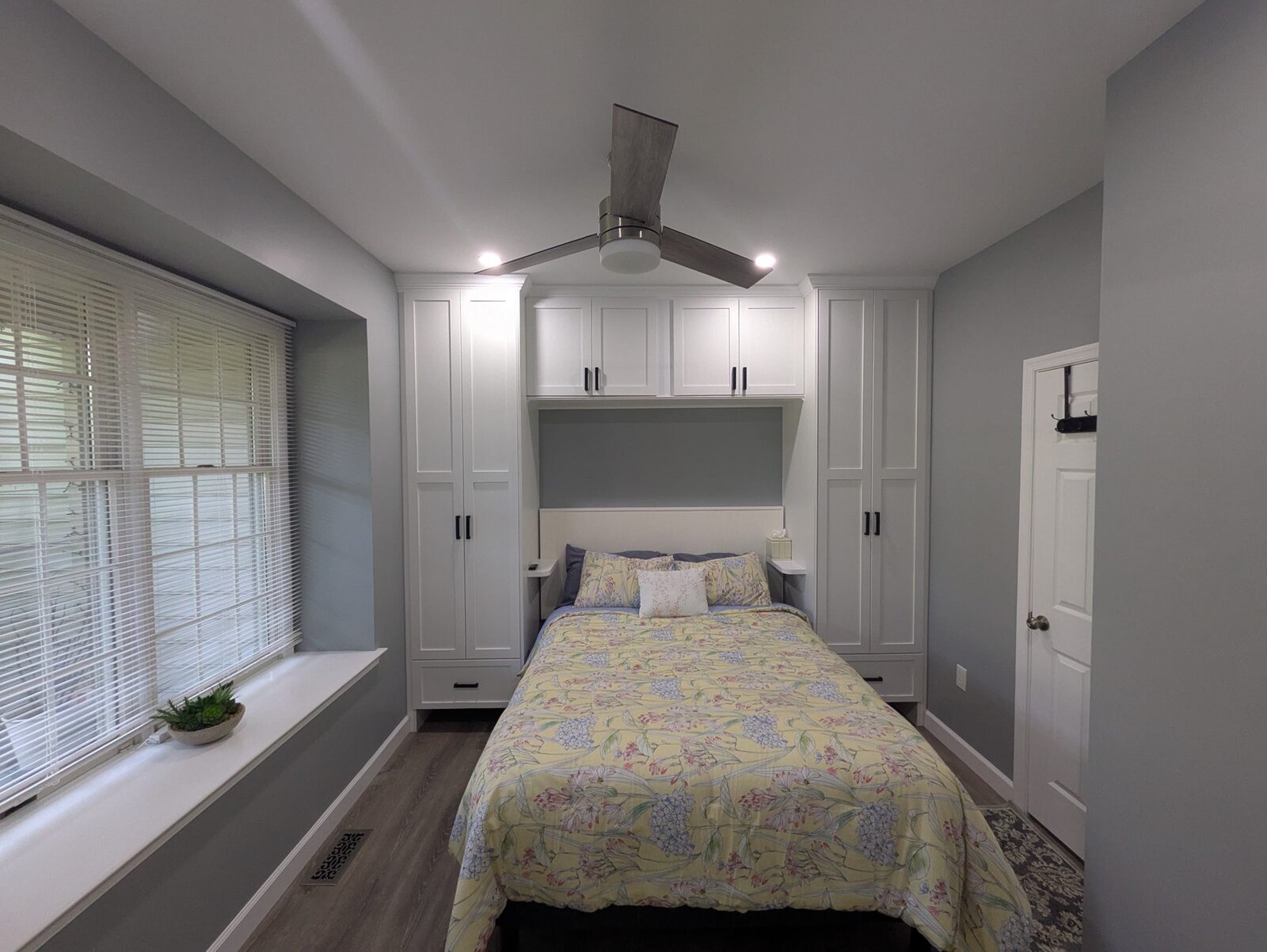 Bedroom wall of built-in wardrobes and cabinets