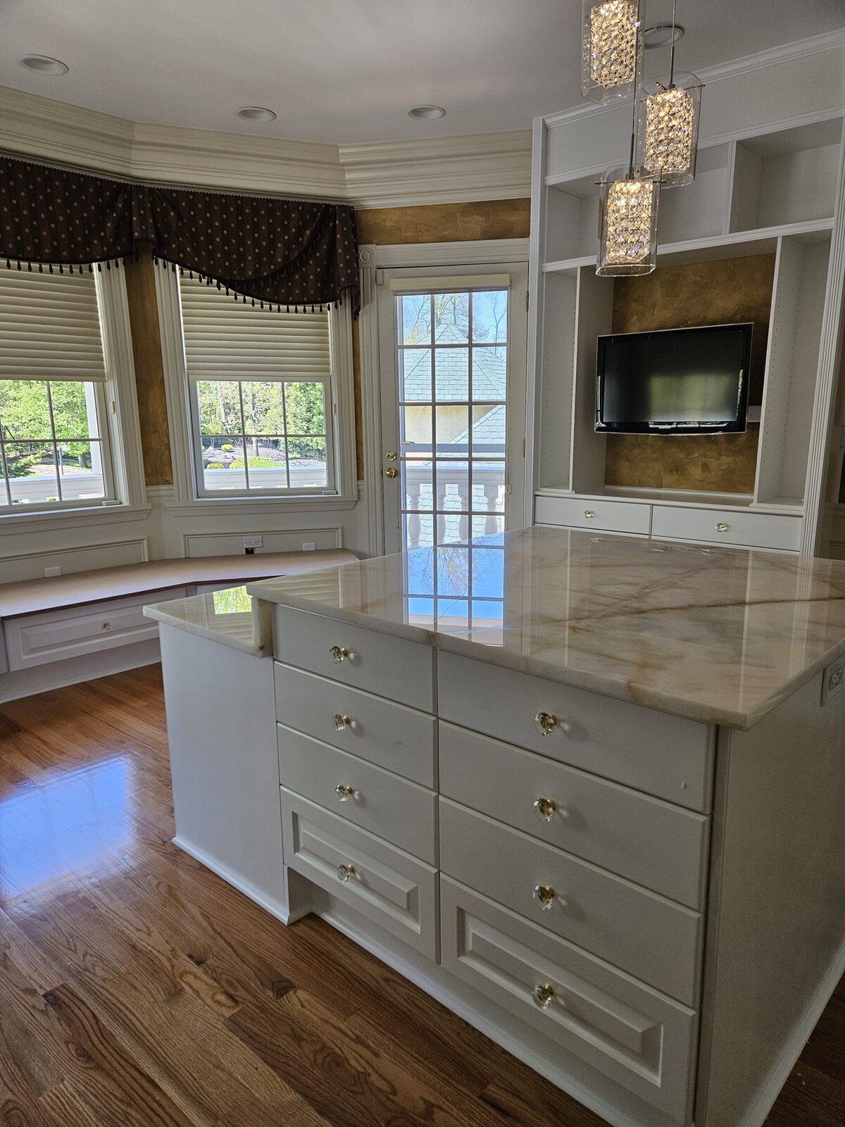 Dressing room of custom built-ins around a center island