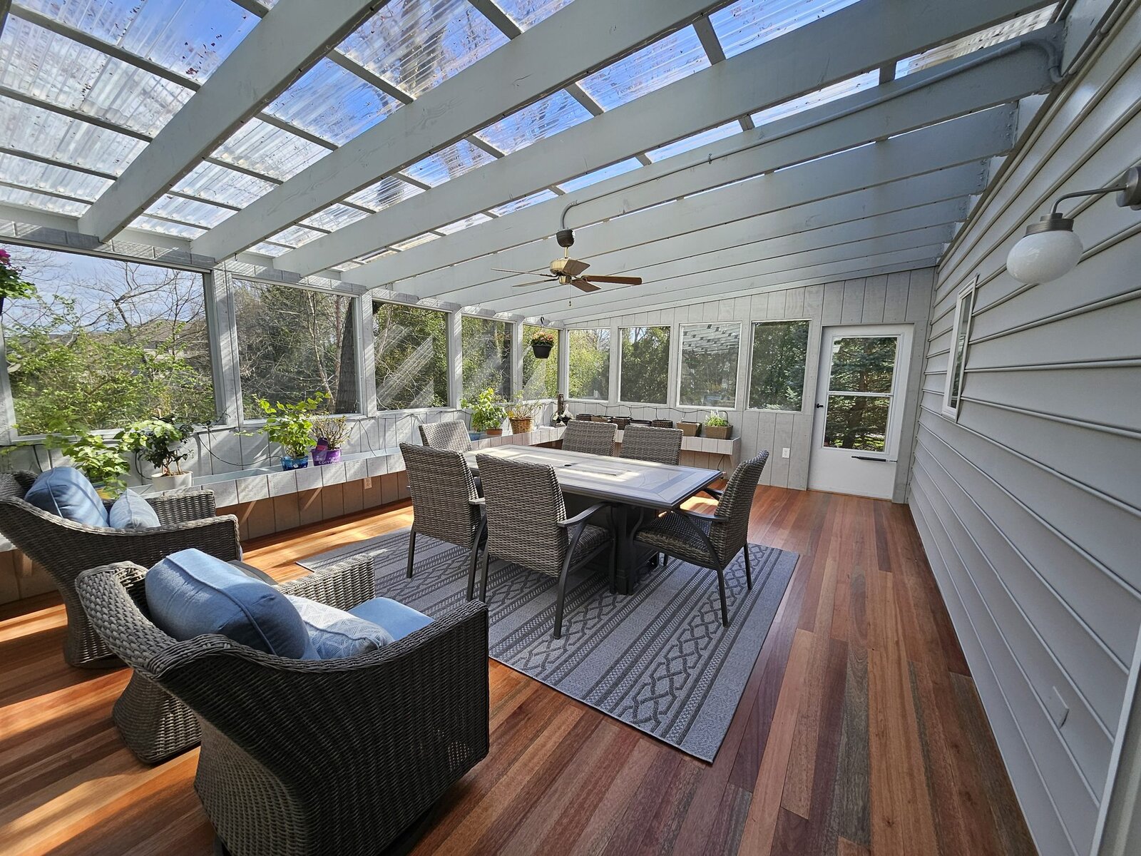 Covered outdoor room with skylit roof and wood decking
