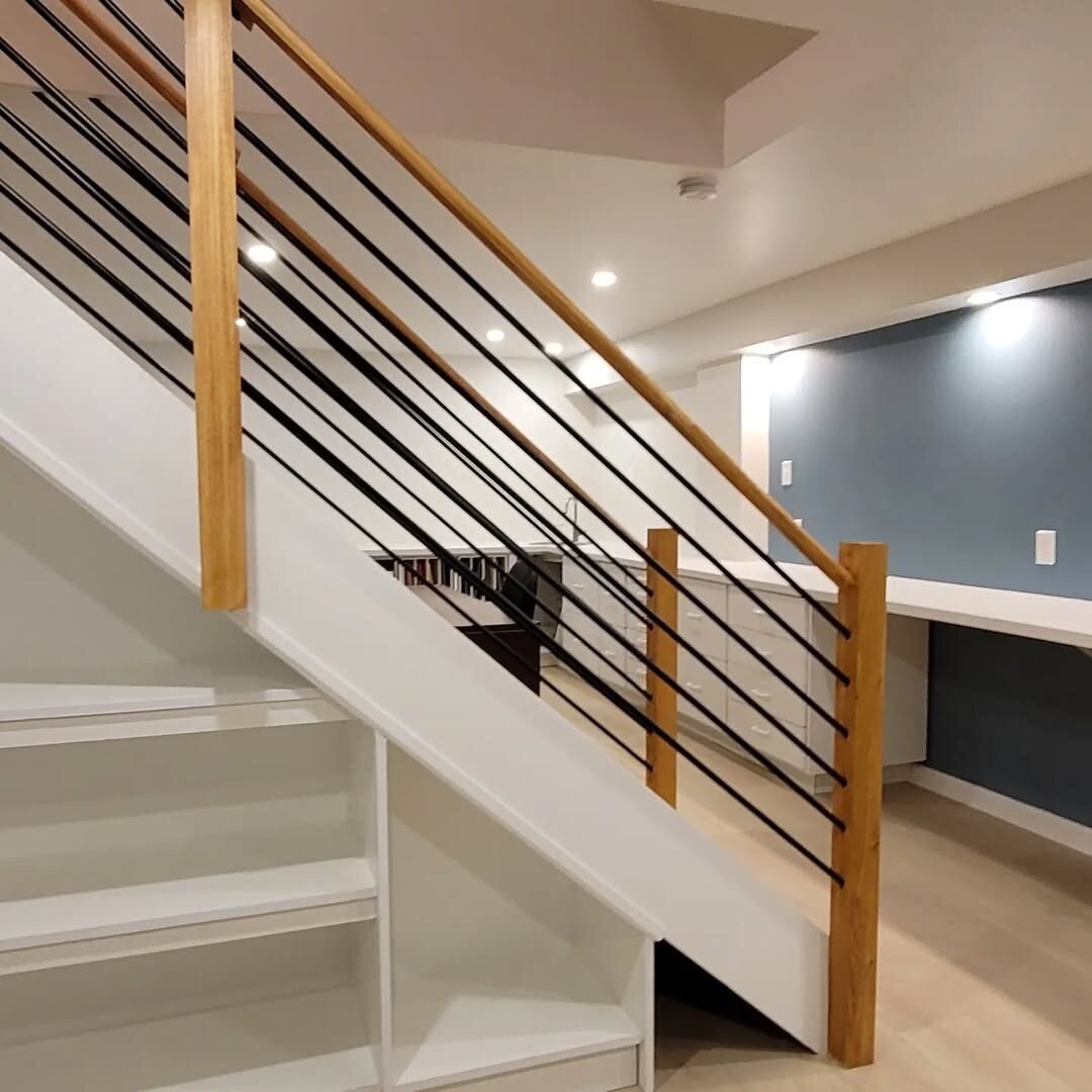 New stair railing with under-stair shelving